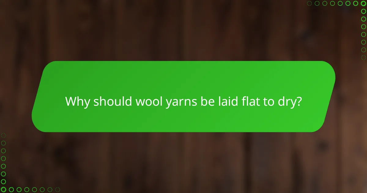 Why should wool yarns be laid flat to dry?